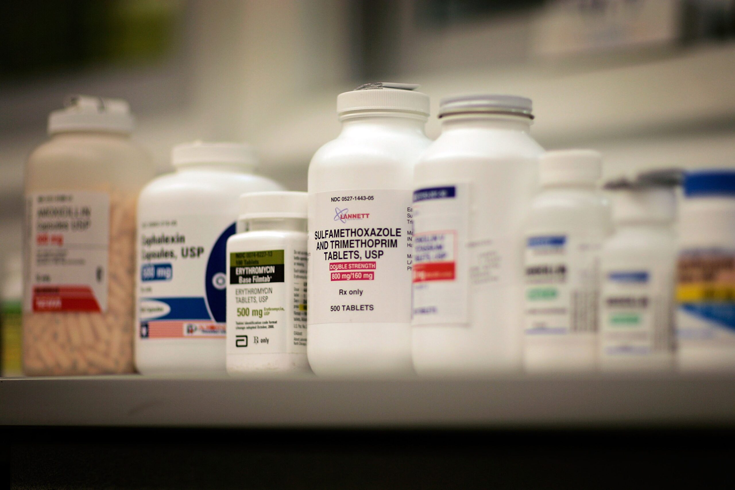 Bottles of prescription drugs sitting on a shelf