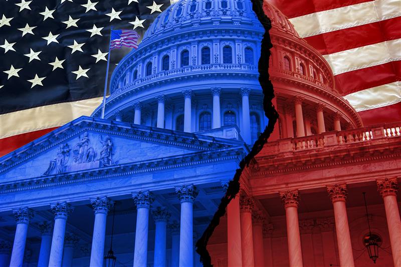 The U.S. Capitol building, half colored blue and half colored red. It